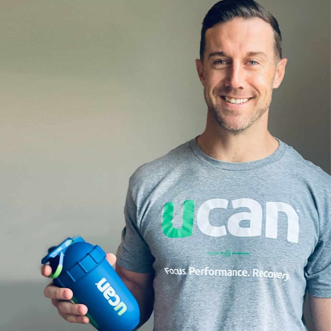 Alex Smith — NFL Comeback Player of the Year and UCAN investor — holding a UCAN bottle after his career-threatening injury recovery